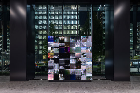 Live camera images from around the world projected on the work “WINDOWS”. The images are divided into rectangles and composed like a mosaic.